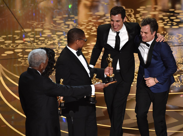 When Spotlight won, he handed out the coveted Oscar statues, gracious and smiling.