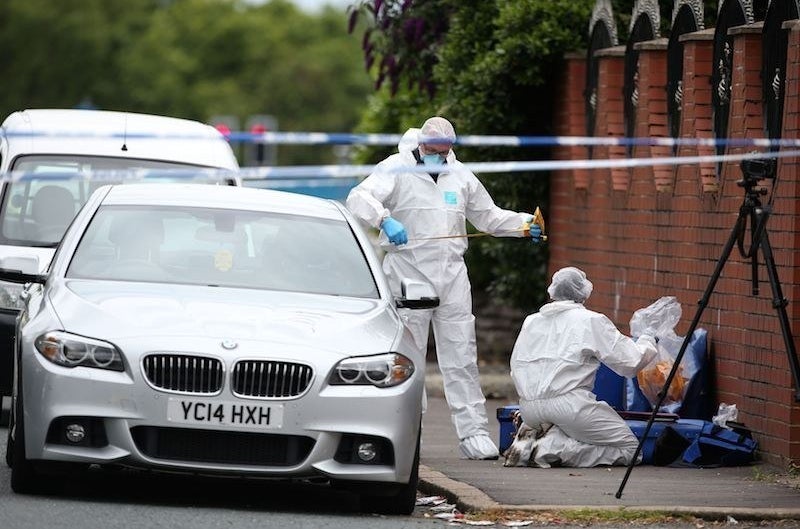Forensic officers at the scene of Paul Massey&#x27;s murder