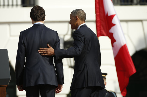 Here we see Obama totally not gently feeling the taught muscle's in Trudeau's chiseled back built by years of boxing.