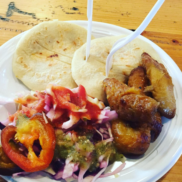 What about these delightful Salvadoran pupusas filled with gooey cheese, refried beans, and perfectly seasoned pork, with a side of platanos and curtido?