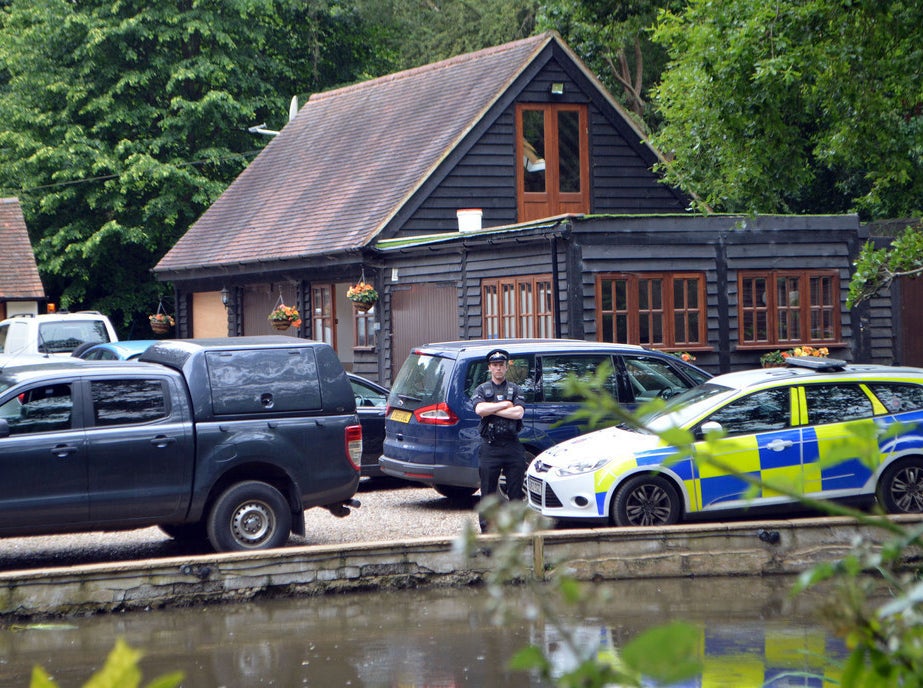 Police at Palmer&#x27;s home after his murder last June