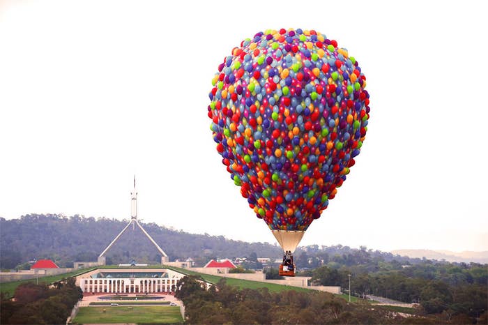 People Growing Plants On Earth Hot Air Balloon And Sample Text