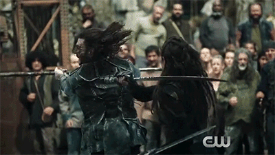 Rothenberg has and continues to stress that Lexa’s sexuality doesn’t affect the way they tell her story and some critics have pointed out that Finn (Thomas McDonell), Clarke’s male love interest in season one and two, was also killed off, so the show is actually giving fair and equal treatment to their queer and straight characters. The problem with that is that when Finn was killed off, fans could easily turn the channel to just about any other show and find some other version of him. When Lexa died, audiences had no other shows or characters to turn to to get their fix. Putting on hold the fact that Lexa was queer for a second, she was also a tough cookie, talented fighter, and brilliant leader who was able to command twelve clans without anybody using the fact that she was a woman to undermine her control. They took issues with some of her ideas, but nobody ever rebelled against her solely because of her gender. Simply put, there is no character like Lexa on television right now.
