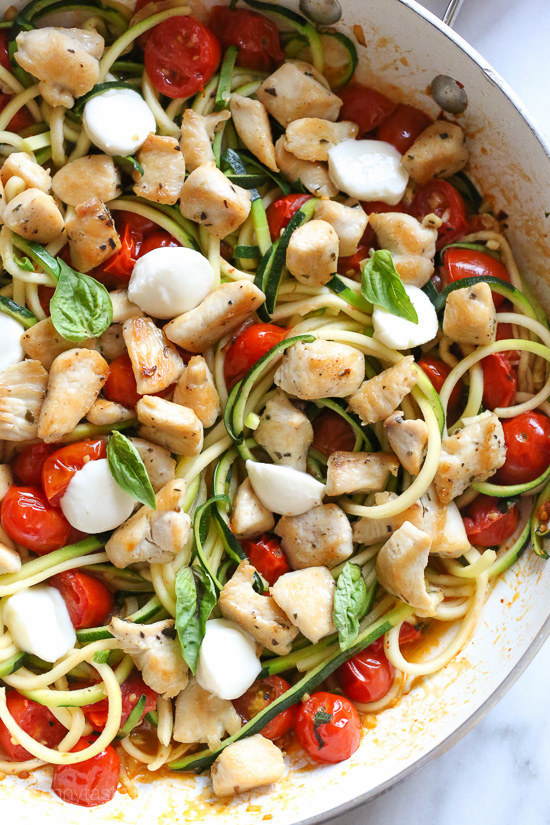 Sauteed bite-sized chicken breast and grape tomatoes cooked with spiralized zucchini, fresh mozzarella and basil, an easy 15-minute meal from SkinnyTaste