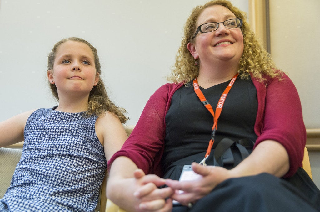 12-year-old Isabelle with her mum Naomi at Parliament House.