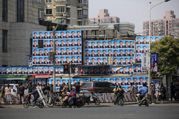 It's a strong picture. That's probably why a "nail house" landlord in downtown Shanghai believed in the portrait's power to defeat a demolition order: the landlord, unidentified, covered his building in hundreds of copies of that photo last Friday.