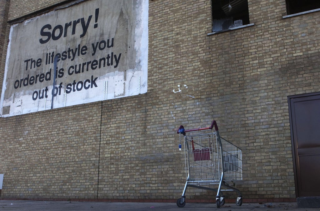 A Banksy piece near Canary Wharf financial district in London.
