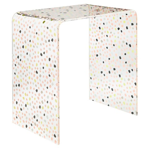 A dotty accent table with maximal storage space underneath.
