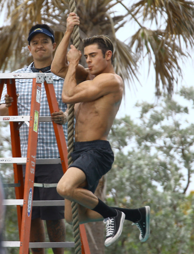 That's right. There are lots of photos of an insanely muscular Zac Efron swinging from a rope (shirtless, obviously).