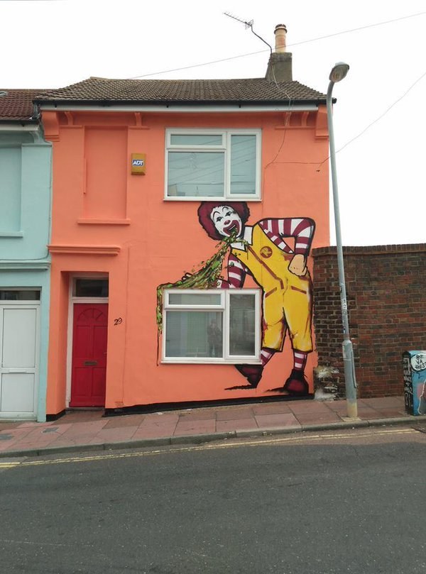 Who wouldn’t want a creepy 15 foot Ronald McDonald throwing up on their house?