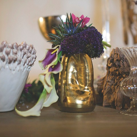 A golden vase that will make even dying flowers look pretty.