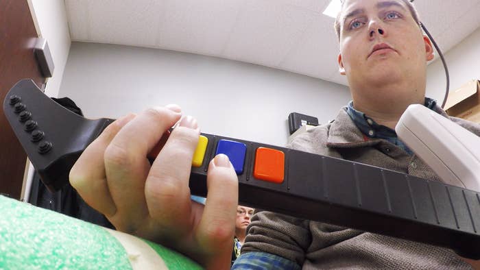 Ian Burkhart plays Guitar Hero as part of the study.