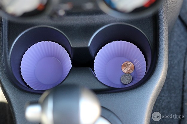 Stick a couple of silicone muffin cups in your cup holders to catch all the dirt that ends up in the crevices.