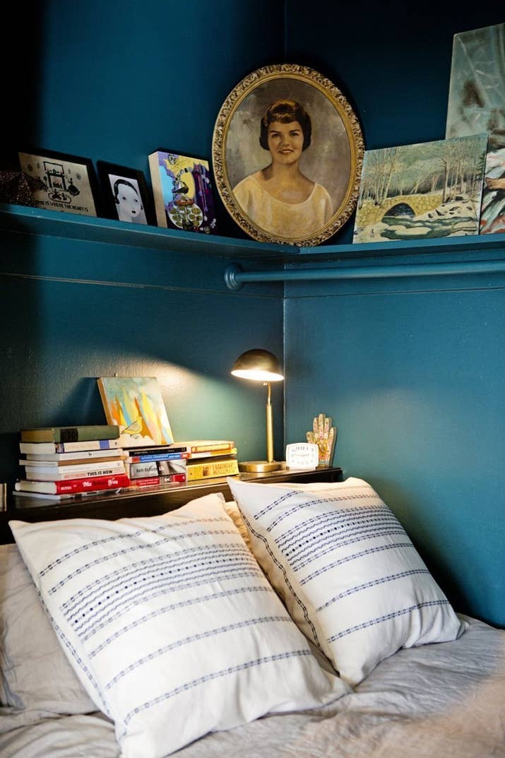 So they're not cluttering up your nightstand. Super tiny apartments can use this as a night stand, too. See more of this apartment here, and get a similar table for $33.65 here.