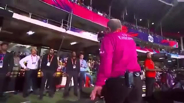 Umpire Ian Gould having to drag Chris Gayle off the ground during the match against Sri Lanka.