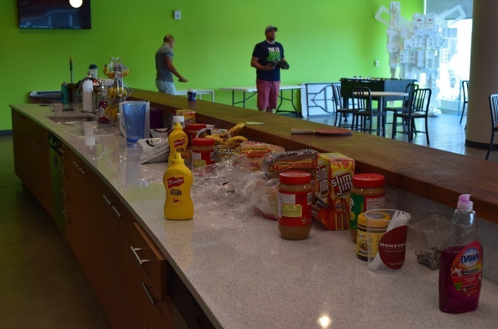 An array of snacks and cornhole players at the Instructure headquarters in Cottonwood Heights, Utah.