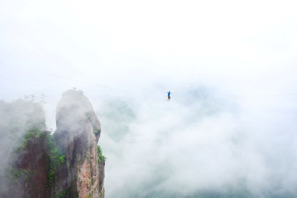 A competitor walks on a tightrope during a performance in Taizhou, Zhejiang Province, China.
