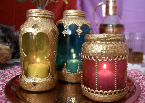 You will need:Old glass jars (spaghetti jars, jam jars...)Gold dimensional puff paintGlass paintPaintbrushWireInstructions:Remove labels from jars and let them dry completely.Apply the gold dimensional paint in various patterns and let it dry.Pour a little bit of glass paint inside the jar and drag the paint up the sides of the jar using the paintbrush, coating all of the jar’s interior and let it dryFill them with candles and they're ready to use.