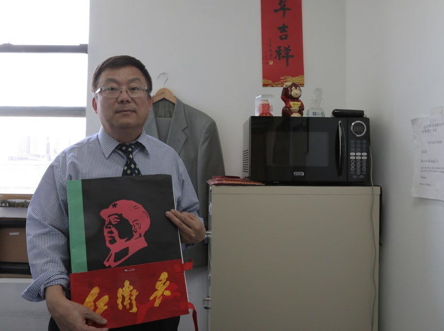 Wang with his picture book on &quot;Red Guards&quot; life