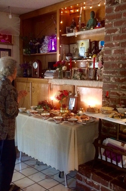 My grandmother, honoring ancestors during giỗ in 2015.