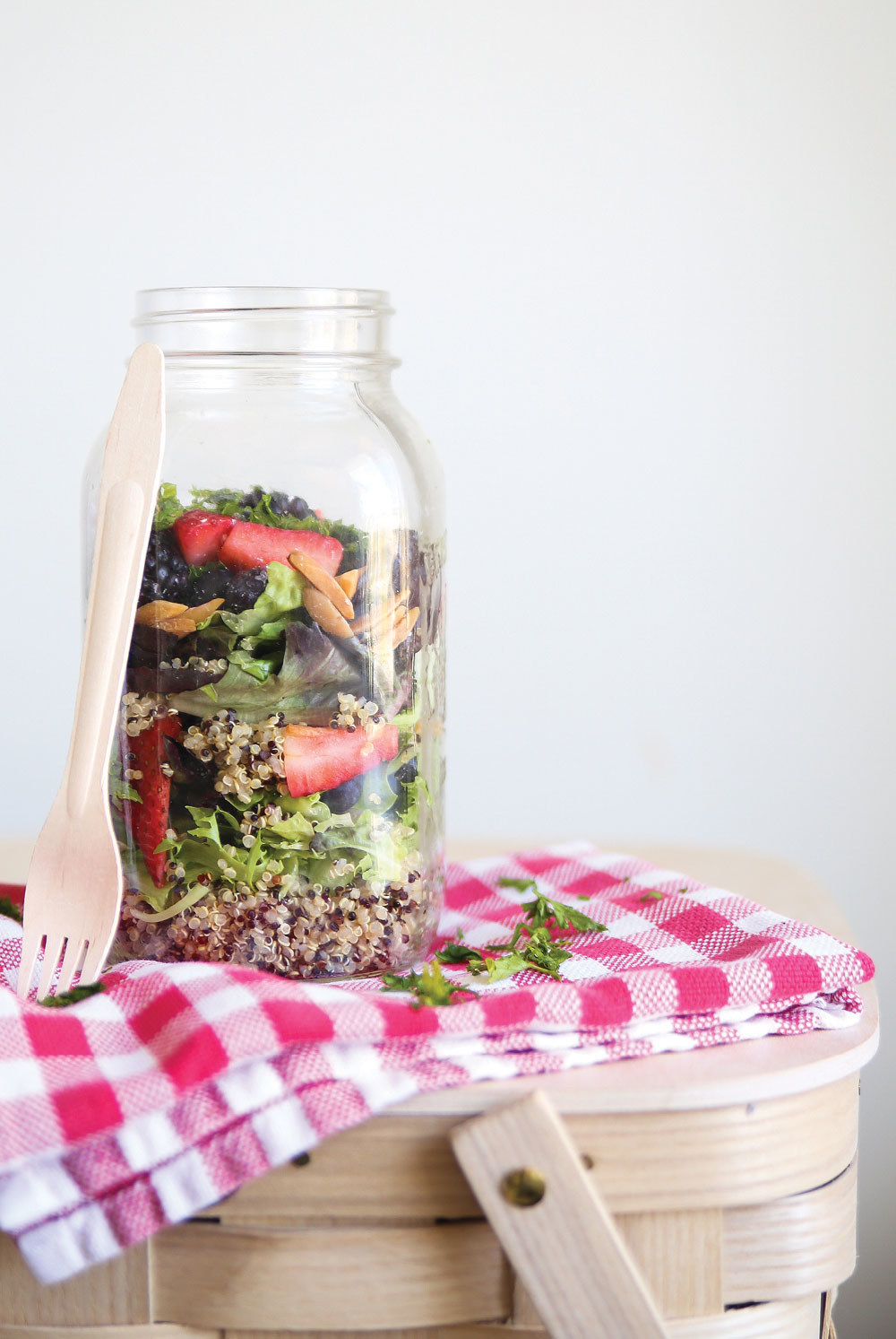 Mason jars are perfect for toting salads to a picnic - keeping the dressing at the bottom ensures that nothing gets soggy. Get the recipe here!