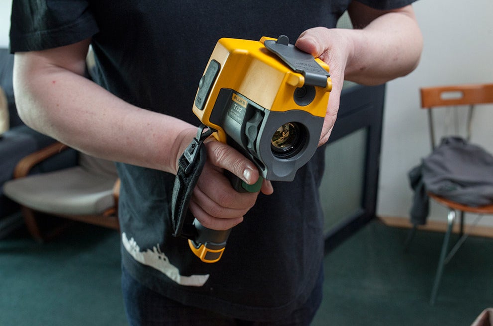 Banaś holding his thermographic camera.