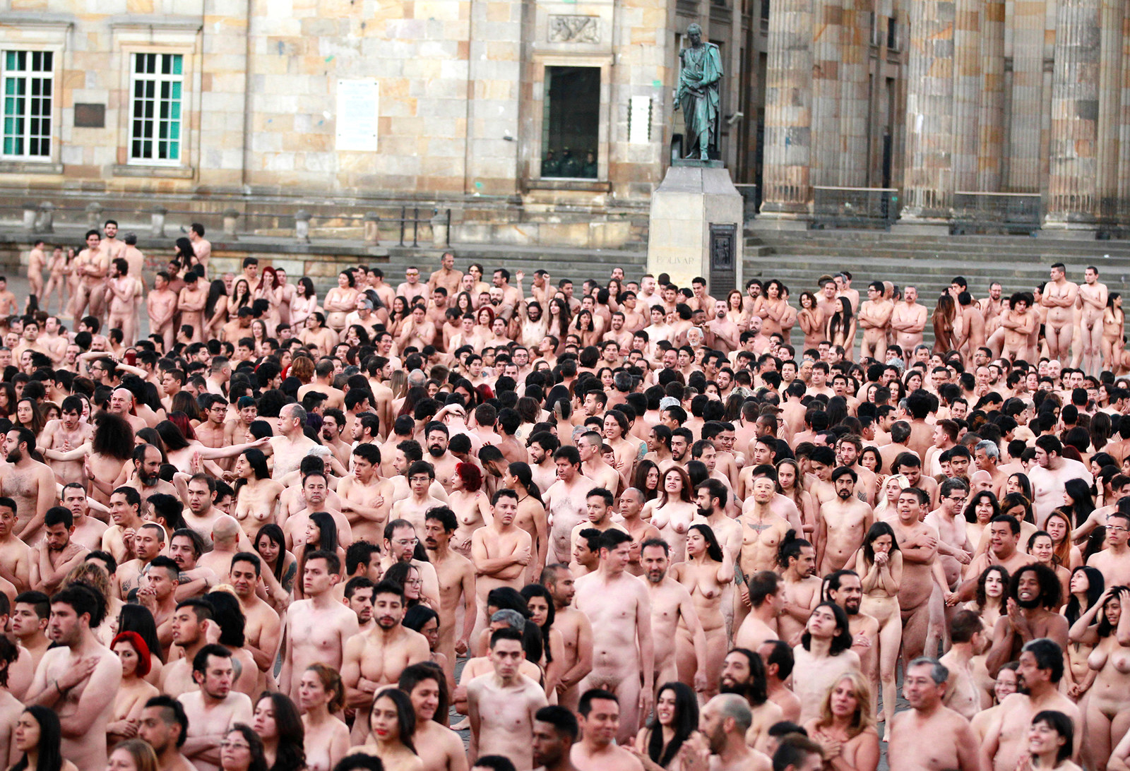 Hundreds of naked volunteers pose for a picture by U.S. artist Spencer Tuni...