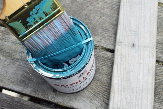 Put a rubber band on top of a paint can to remove the excess paint from the brush.