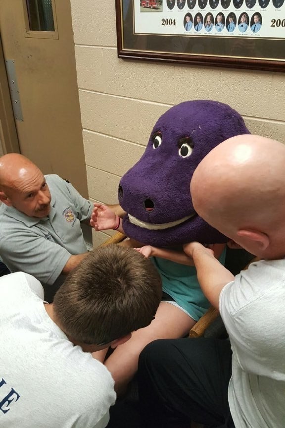 This 15 Year Old Got Stuck In A Barney Head And Firefighters Had To Save Her