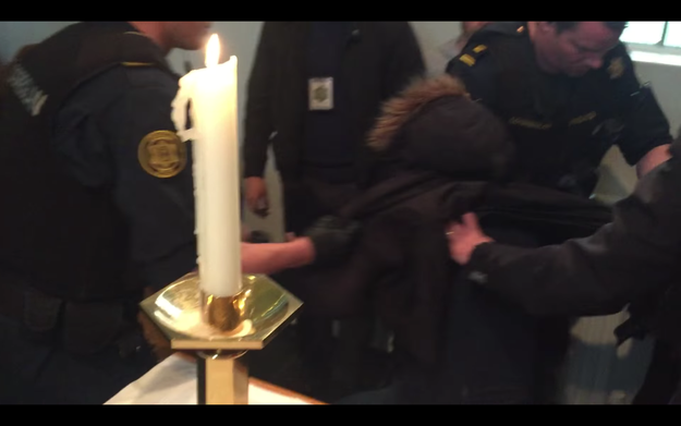 After briefly speaking to the pastors, the police grabbed the men and dragged them out the church.