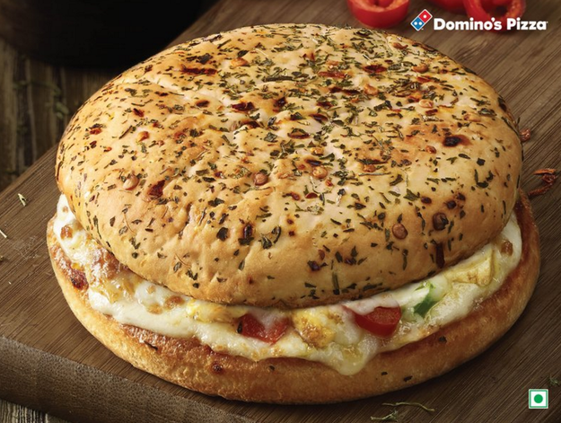 BEHOLD: A Burger Pizza, which is a pizza that's assembled like a burger. So we've got dough, beautiful melted cheese, more dough and...oops, drooling.