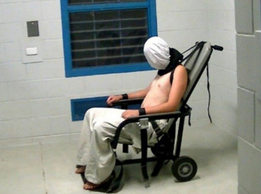 Dylan Voller restrained with a spit hood.