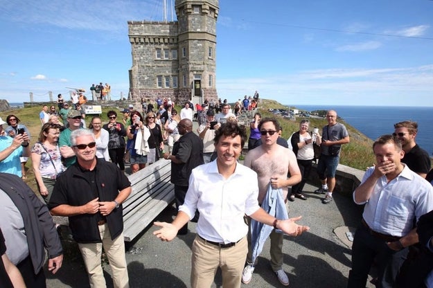 But now the tables have finally turned. During a stop on Signal Hill in St. John's, Newfoundland, comedian Mark Critch stripped off his shirt for this glorious photobomb.
