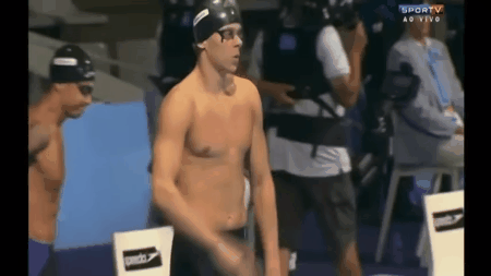 For many swimmers, this is just a ritual to calm their nerves. Others say that slapping themselves also releases endorphines, and boosts circulation.
