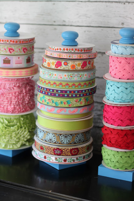 Organize your ribbon collection on a paper towel holder.