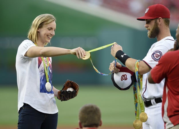 But she quickly realized she couldn't get a good wind-up with all those pesky medals weighing her down.