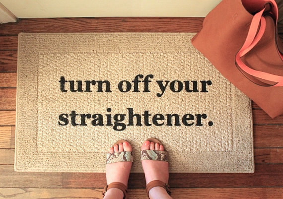 A doormat that reminds you to check your hot tools before the house burns down.