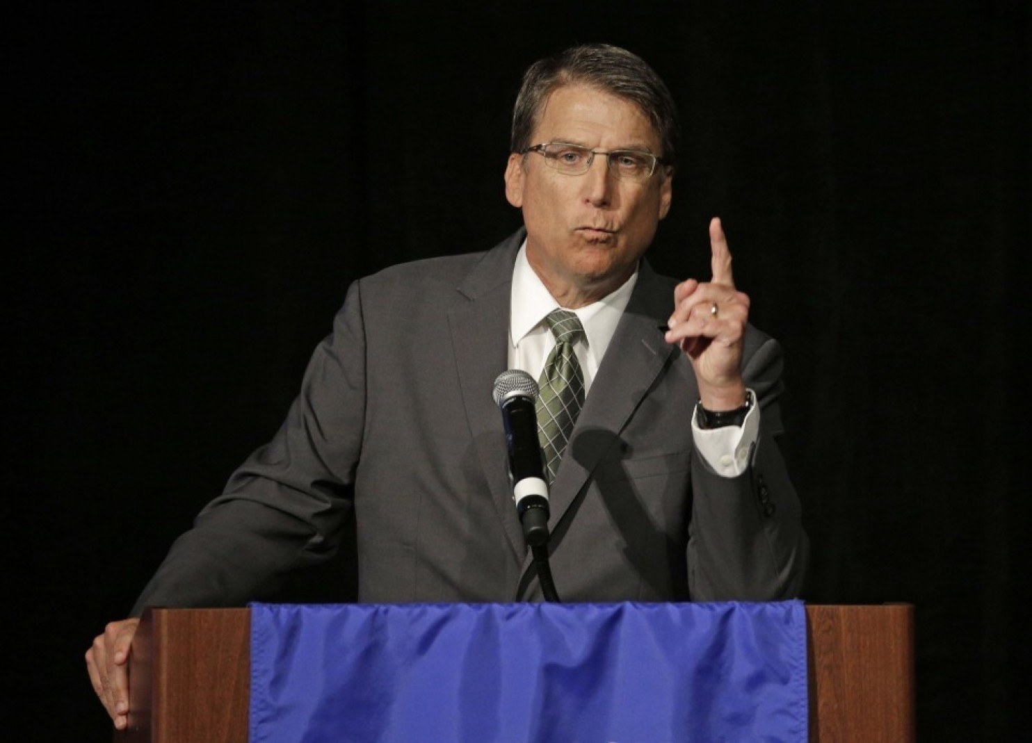A federal judged ruled on Friday that two transgender students and one transgender employee must be allowed to use the restroom that matched their gender identity on the University of North Carolina campuses. He also said that the university cannot enforce the House Bill 2, also known as HB2 or the "bathroom bill", which puts restrictions on what bathrooms transgender people are allowed to use, which has sparked controversy across the country.District Judge Thomas Schroeder put a block on the campus, so that the students and employee in this case don't have to follow the restroom restrictions enforced by the state law. This is a temporary block, and his final decision will not be made until the state case begins trial in November. HB2 was passed in March, and forces transgender people to use public restrooms that match their sex at birth, rather than the gender they identify with. In addition, it doesn't include gender identity of sexual orientation on statewide anti-discrimination policies.Schroeder wrote that the schools cannot enforce the law ordering people to using bathrooms according to what is on their birth certificate until a final decision is made in the case. State leaders claim that the law is necessary in order to protect the safety and privacy of women and girls, by keeping men out of women's restrooms. Although they claim it is for safety reasons, transgender residents argue that restroom safety is already covered, and the law is discriminatory and unsafe for them. “North Carolina’s peeping and indecent exposure statutes continue to protect the privacy of citizens regardless of” the bathroom provision, Schroeder wrote, “and there is no indication that a sexual predator could successfully claim transgender status as a defense against prosecution under these statutes.”Schroeder said that his injunction shouldn't bring hardship to state leaders defending the law, failure to block the law “would cause substantial hardship to the individual transgender Plaintiffs, disrupting their lives.”Schroeder said that the plaintiffs and students and employee affected in the lawsuit "are likely to succeed" in their proving that the bathroom bill violates the Title IX of the Education Amendments of 1972, which doesn't allow discrimination based on sex in federally-funded education programs. He did add that the plaintiffs have not clearly shown they are likely to succeed on that claim, so he reserved final judgement on further constitutional claim until the case begins trial in November. “Today is a great day for me and hopefully this is the start to chipping away at the injustice of H.B. 2 that is harming thousands of other transgender people who call North Carolina home,” Joaquín Carcaño, lead plaintiff in the case, said in a statement released by the ACLU. “Today, the tightness that I have felt in my chest every day since H.B. 2 passed has eased. But the fight is not over: we won’t rest until this discriminatory law is defeated.