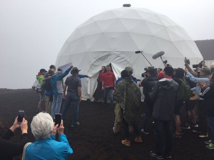Six scientists on Sunday completed a yearlong isolation mission in a geodesic dome that they could only leave while wearing spacesuits.