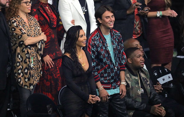 While Kanye was preparing to hit the stage for his speech, Jonathan was granted seat-filler priority, snagging a chair next to his bestie.