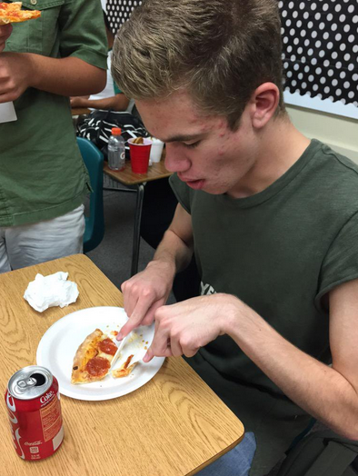 Cutting it. Cutting the pizza! CALL THE POLICE!