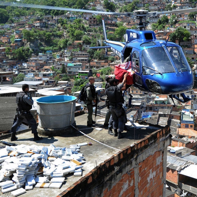Riot Special Forces police airlift six tons of marijuana found in a bunker during a raid in the Morro do Alemao shantytown on November 28, 2010.