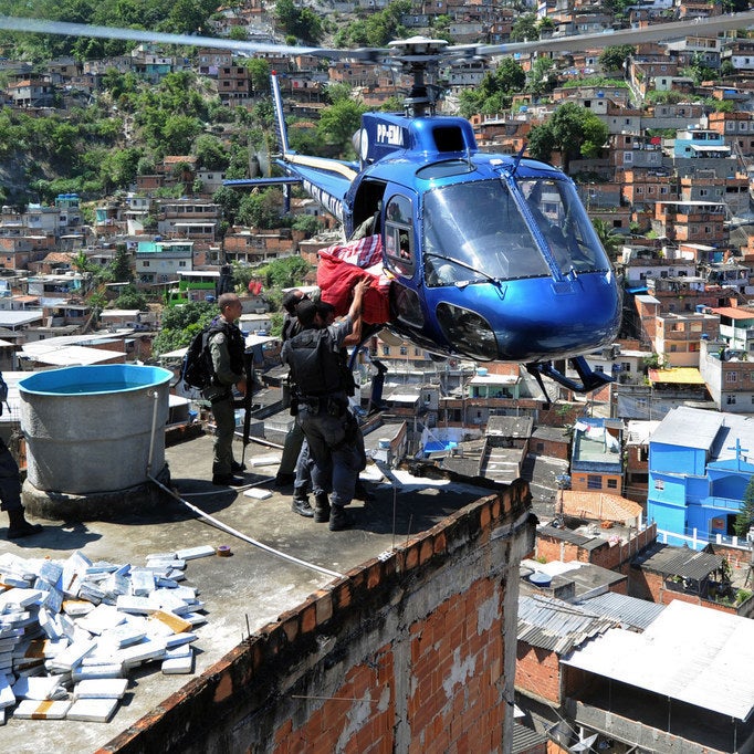 Riot Special Forces police airlift six tons of marijuana found in a bunker during a raid in the Morro do Alemao shantytown on November 28, 2010.