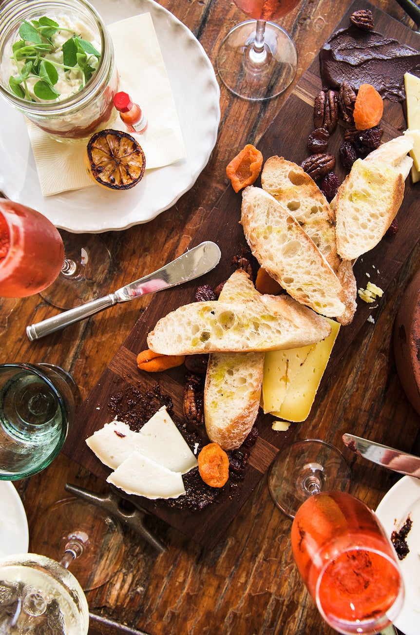 Cheese board with local and international cheeses, spiced nuts, fig mostarda, and seasonal jams at Pippin.