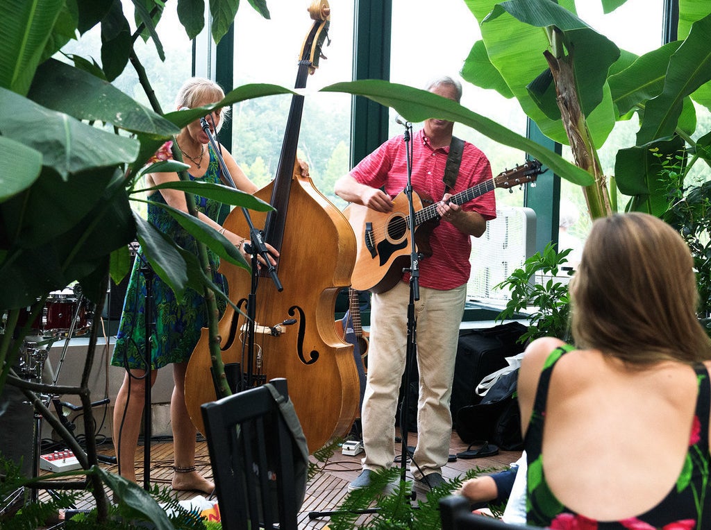 Live music is a staple at Glass House — a very welcome one that only adds to the lively vibe of the greenhouse environment.