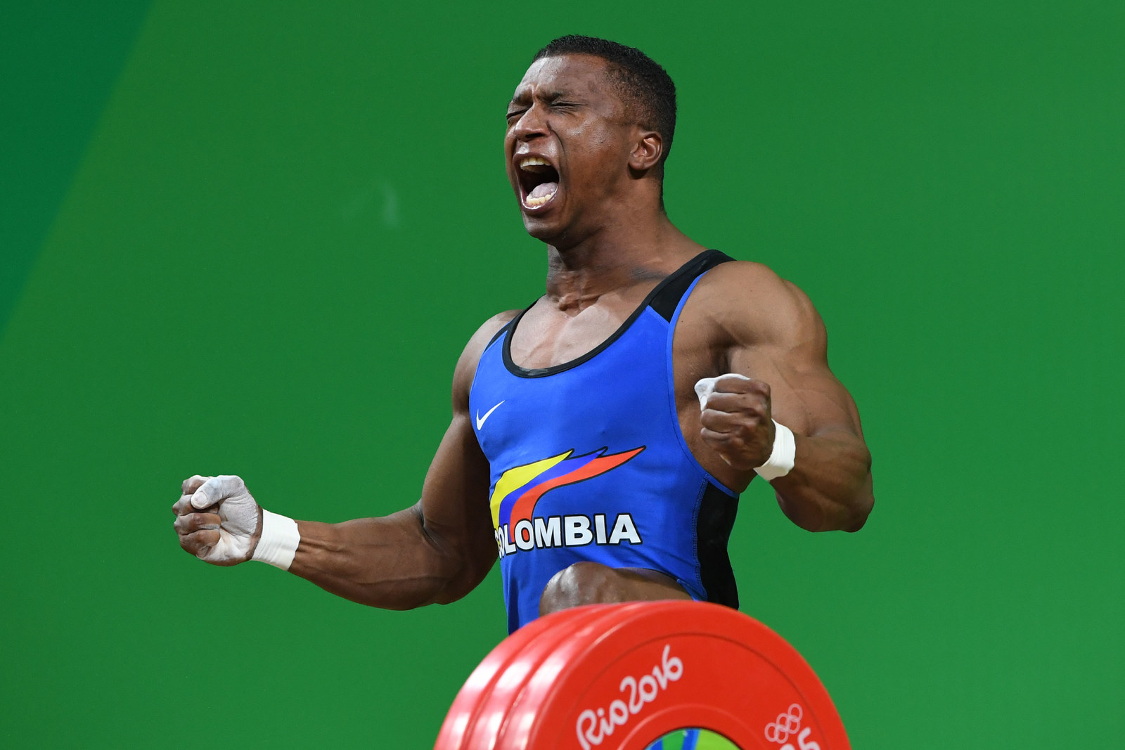 This Weightlifter Won Gold, Took Off His Shoes, Then Immediately