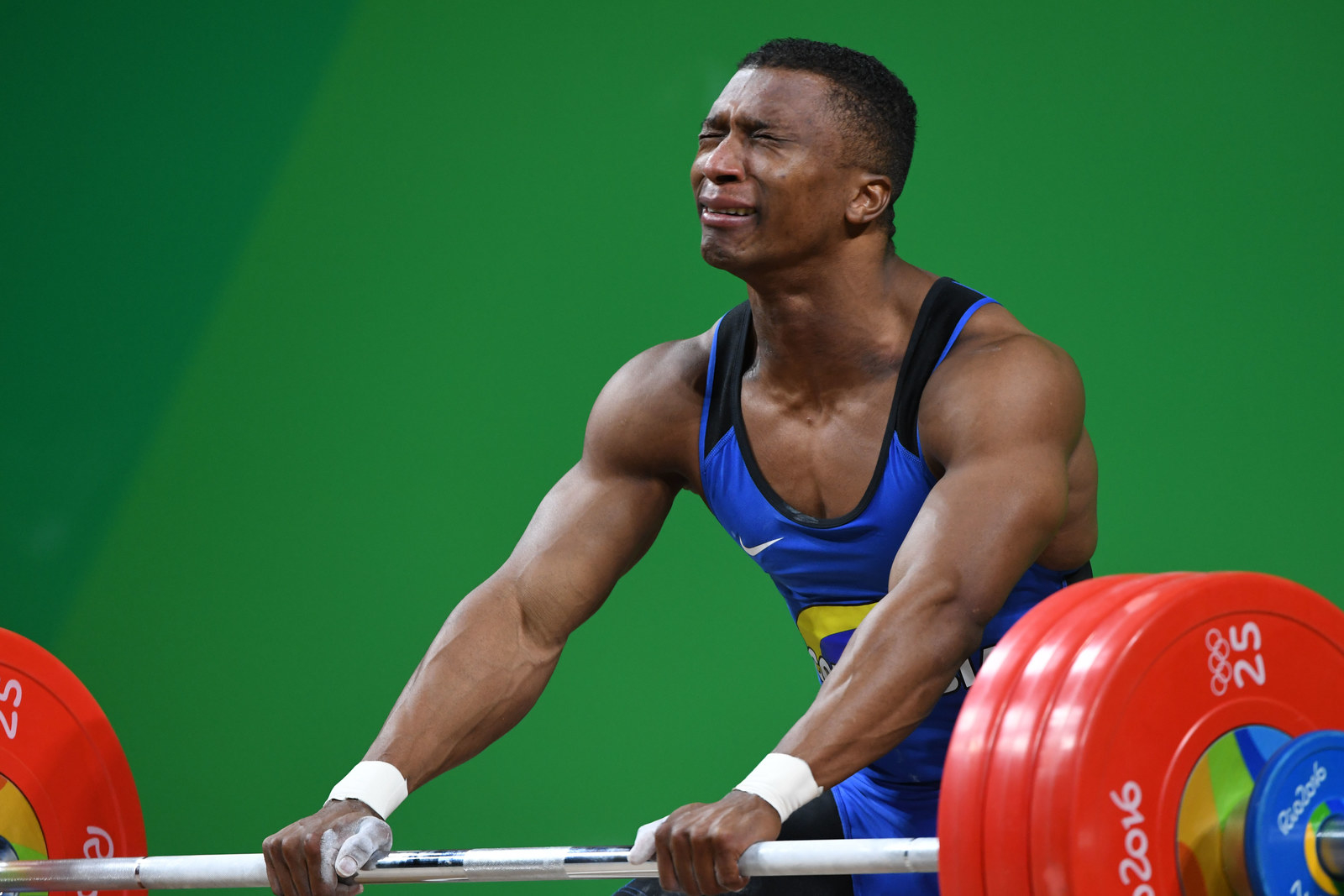 This Weightlifter Won Gold, Took Off His Shoes, Then Immediately