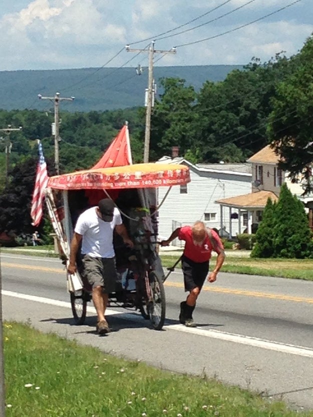 He doesn't really have money, but strangers he met on the road have been pouring support to him: a heart-felt encouragement, a warm meal, or a lift up a hill — the rickshaw, his good buddy, carries all his luggage and weighs as heavy as 400 pounds.