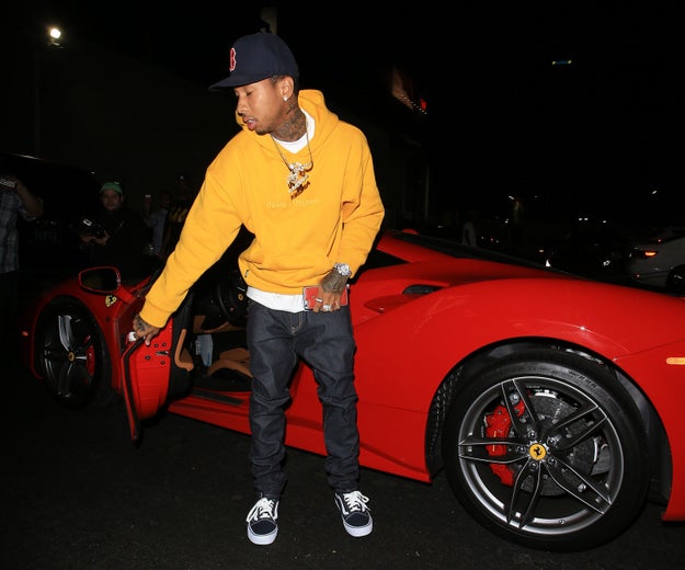 Throughout August, Tyga was seen driving around in a red hot Ferrari, 'cause he's rich and stuff.