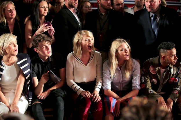 Tay looked v v proud next to fellow bestie Martha Hunt, and Gigi's brother and mother, Anwar and Yolanda.